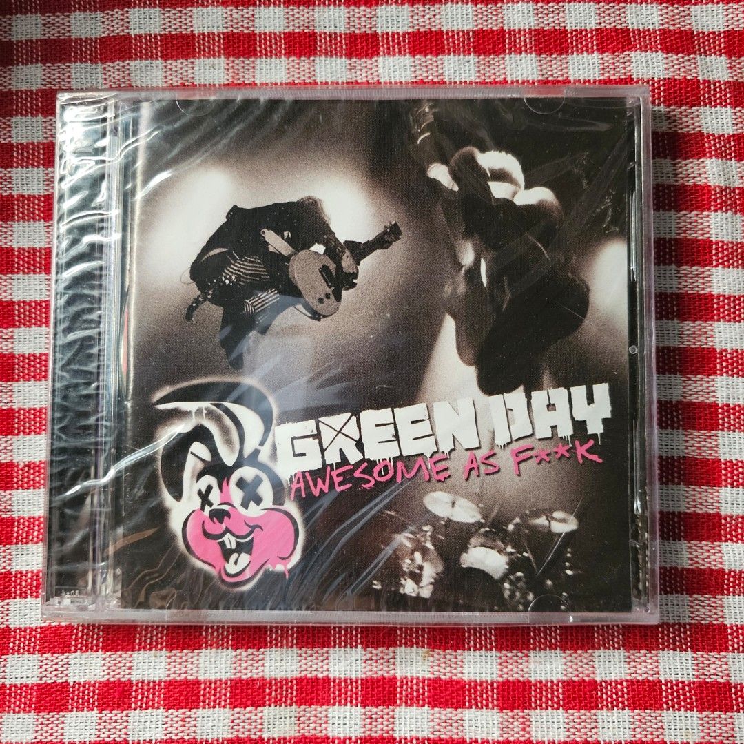 Green Day Awesome as F**k CD (Category: CDs & DVDs) located in Quezon City. Submitted by serefrenpaz (Listing ID 1410927971, Image 1). Description: Sealed CD of Green Day's "Awesome as F**k" album. Features tracks like "21 Guns", "Know Your Enemy", and "American Idiot". Includes a parental advisory warning. The CD is still in its original packaging. Good Day Buyers! 💖💖💖Here are the PAYMENT payment options 💖💖💖 ✨1. GCash - 09164862096 ✨2. Ban