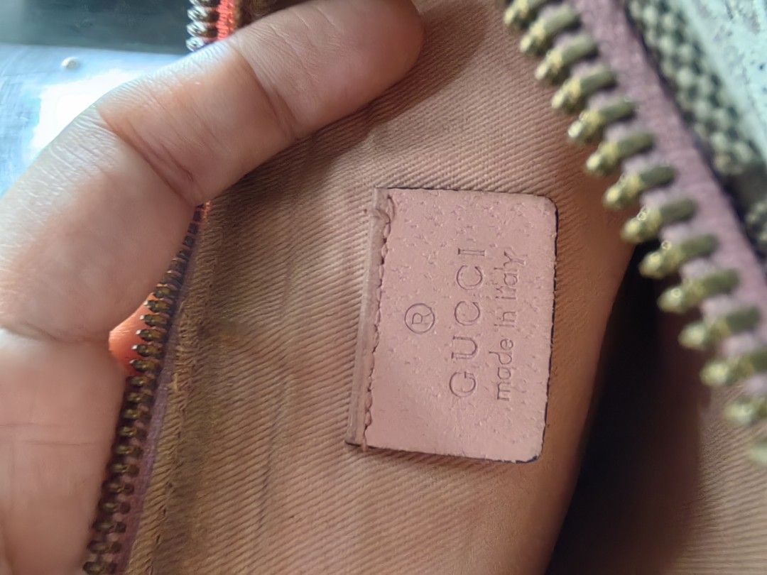Gucci Handbag with Pink Interior (Category: Luxury Bags & Wallets) located in San Pedro. Submitted by charlie0603 (Listing ID 1404771928, Image 3). Description: - Authentic Gucci handbag - Pink interior - Zipper closure - Gold-toned zipper - Distinct exterior pattern - Visible serial number on pink tag - Well-maintained condition.