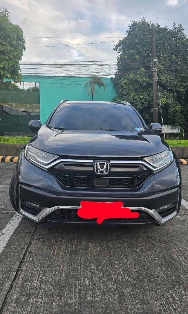 Honda CR-V S /X AWD Auto (Category: Used Cars) located in Manila. Submitted by richardmuega15 (Listing ID 1411019916, Image 2). Description: -Top of the line Honda CRV Model 2021, 7-seater, Cosmic Blue Metallic, 44k ODO, Casa-maintained with official records from Honda, 1st owner. -Last Generation of Diesel-type engine for CRV model. -All Wheel Drive, 9-speed Automatic, touch-button transmission -Kick-sensor power tailgate (hands-free) -Honda Sen