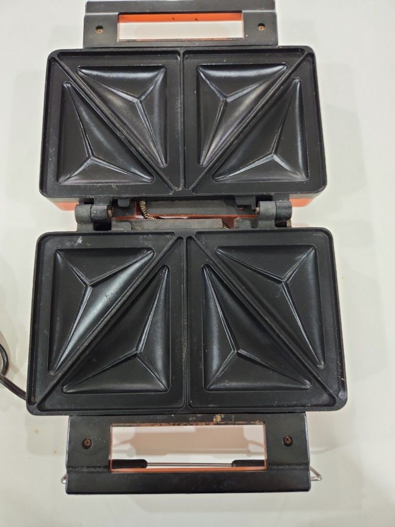Imarflex Sandwich Toaster (Category: Ovens & Toasters) located in San Juan City. Submitted by iamryn (Listing ID 1410914502, Image 2). Description: - Orange Imarflex sandwich toaster - Features a handle and power cord - Model name visible on the front - In good working condition - No box.