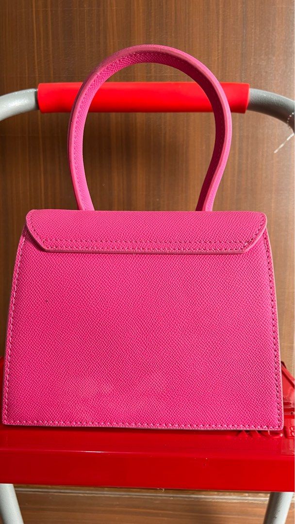 Jacquemus Le Chiquito Mini Bag - Pink (Category: Luxury Bags & Wallets) located in Licab. Submitted by gorgbagsph (Listing ID 1411058940, Image 3). Description: - Preloved Jacquemus Le Chiquito Mini Bag. - Color: Pink. - Features a structured rectangular shape. - Top handle for easy carrying. - Secure magnetic closure. - Gold-tone Jacquemus logo on the front. - Interior lined with neutral-colored fabric. - Perfect mini bag for essentials. - Styli