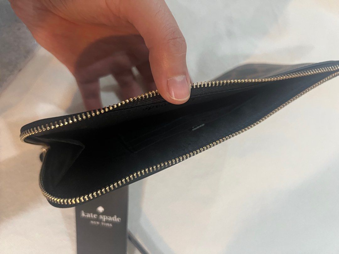 Kate Spade Lucy Med Zip Wristlet (Category: Luxury Bags & Wallets) located in Quezon City. Submitted by bitsxpieces (Listing ID 1411034951, Image 2). Description: - Authentic Kate Spade Lucy Med Zip Wristlet - Stylish leopard print design - Features a convenient wrist strap - Black interior with zip closure - Comes with original tags - Comparable value: CAD 169 / USD 139 Available in other designs: (see last 3 photos) -candied cherry (red) -black
