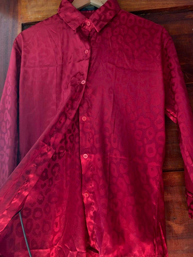 La Lune Classic Closet Red Blouse (Category: Blouses) located in Cavite. Submitted by cssndrakateg (Listing ID 1410994486, Image 2). Description: - Red blouse from La Lune Classic Closet - Features a subtle leopard print - Long sleeves - Classic button-down design - Made of shiny, silky material - Suitable for casual and semi-formal events.
