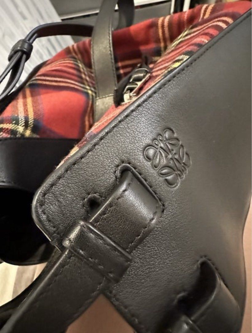 Loewe Hammock Tartan Small Bag (Category: Luxury Bags & Wallets) located in Taguig. Submitted by bianca625 (Listing ID 1410977347, Image 2). Description: - Authentic Loewe Hammock Tartan Small Bag - Red and black tartan pattern - Black leather accents - Zipper closure - Detachable strap - Black fabric lining with small pocket - Includes Loewe tag - Made in Italy.