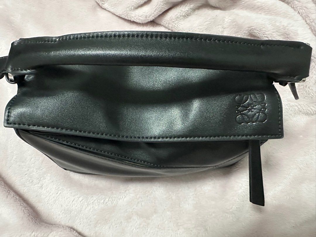 Loewe Puzzle Bag Black (Category: Luxury Bags & Wallets) located in Quezon City. Submitted by alen13 (Listing ID 1411058785, Image 2). Description: - Loewe Puzzle Bag - Top handle and detachable shoulder strap - Includes Loewe dust bag and care cards - Secure zip closure - Fabric interior - Loewe logo detail - Self authentication recommended.