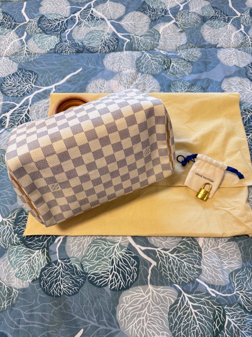 LV Speedy 25 in Damier Azur (Category: Luxury Bags & Wallets) located in Quezon City. Submitted by christineboller (Listing ID 1410925145, Image 3). Description: LV Speedy 25 in Damier Azur In 9.5/10 condition, very clean patina. Handle patina with light markings but can be cleaned. Very clean interior. Comes with dustbag and LV lock only (no key) for only P32k.
