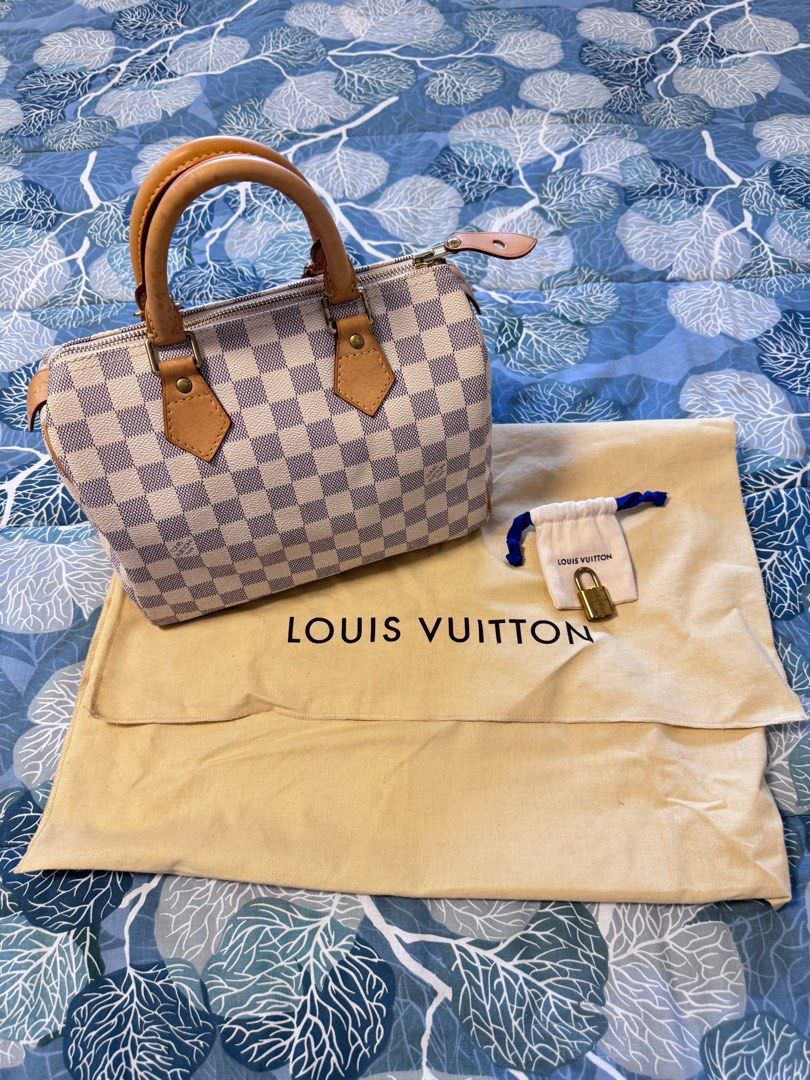 LV Speedy 25 in Damier Azur (Category: Luxury Bags & Wallets) located in Quezon City. Submitted by christineboller (Listing ID 1410925145, Image 1). Description: LV Speedy 25 in Damier Azur In 9.5/10 condition, very clean patina. Handle patina with light markings but can be cleaned. Very clean interior. Comes with dustbag and LV lock only (no key) for only P32k.
