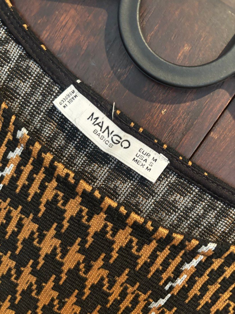 Mango Basics Houndstooth Dress (Category: Dresses) located in Quezon City. Submitted by pipsqueakscorner (Listing ID 1410924248, Image 2). Description: - Mango Basics dress - Houndstooth pattern - Size M - Long sleeves - Round neckline - Colors: Black, brown, white - Woven fabric - Perfect for casual wear.