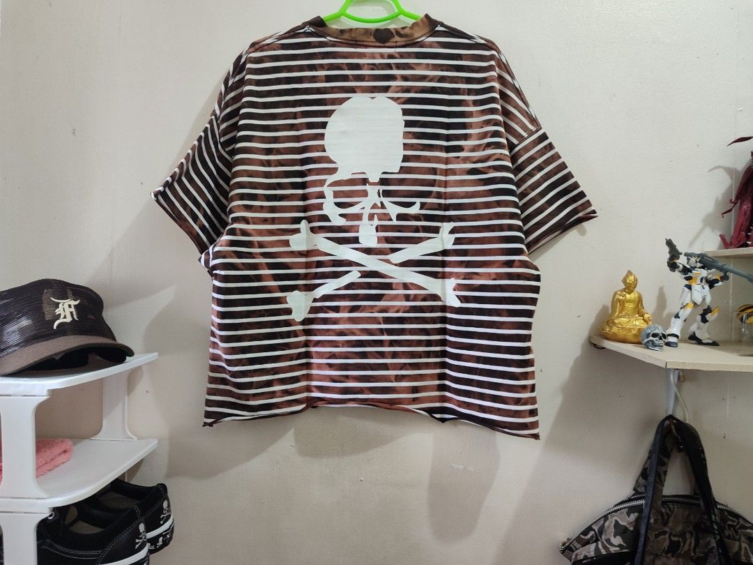 Mastermind Japan Striped Skull Box Fit Tee (Category: Tshirts & Polo Shirts ) located in Antipolo. Submitted by grailed_rizal (Listing ID 1410945608, Image 2). Description: Size: 24x25 - Mastermind Japan T-shirt - Unique striped design - Brown and white striped pattern - Skull and crossbones graphic on the back - Brand logo on collar - Crew neck - Short sleeves.