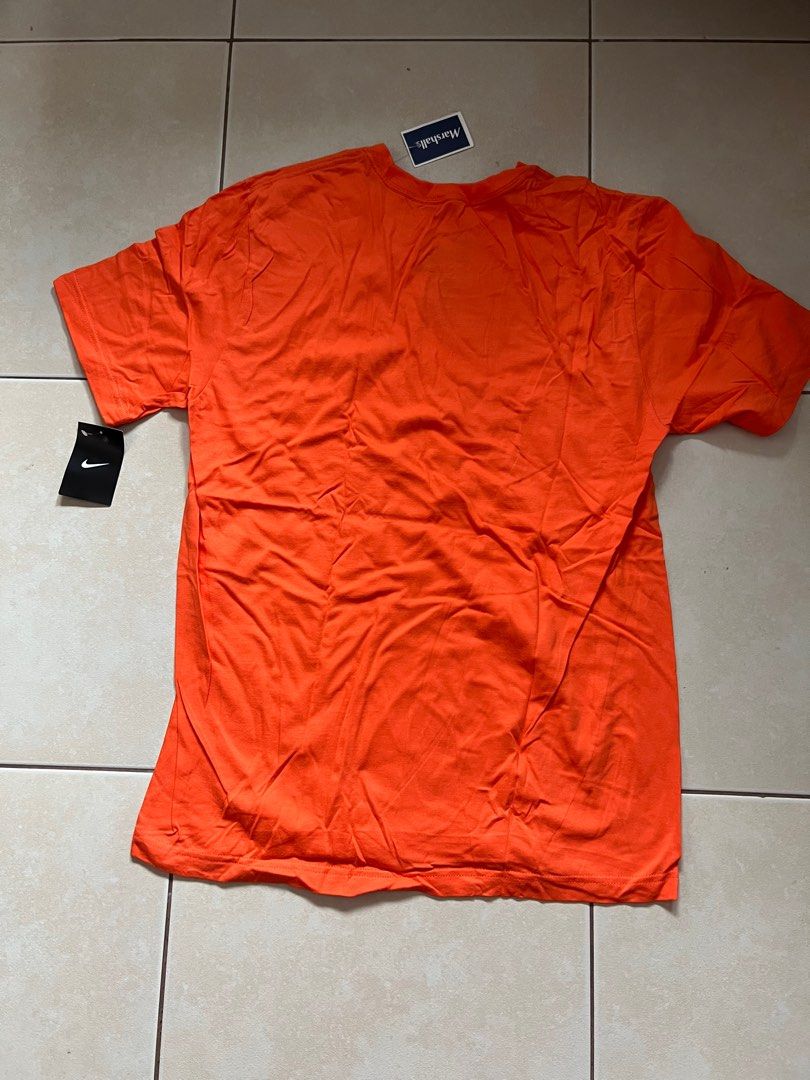 Nike Orange T-Shirt with White Logo (Category: Tshirts & Polo Shirts ) located in Mandaluyong City. Submitted by prelovedbyshayne (Listing ID 1410960802, Image 3). Description: - Orange Nike t-shirt - White Nike logo - Size: Large - Fit: Regular - Material: 100% Cotton - Made in Honduras - Sourced from Marshalls - Washing instructions on inner tag -Price:600+sf -Location: Mandaluyong -MOP: Gcash/BDO -RFS: decluttering.