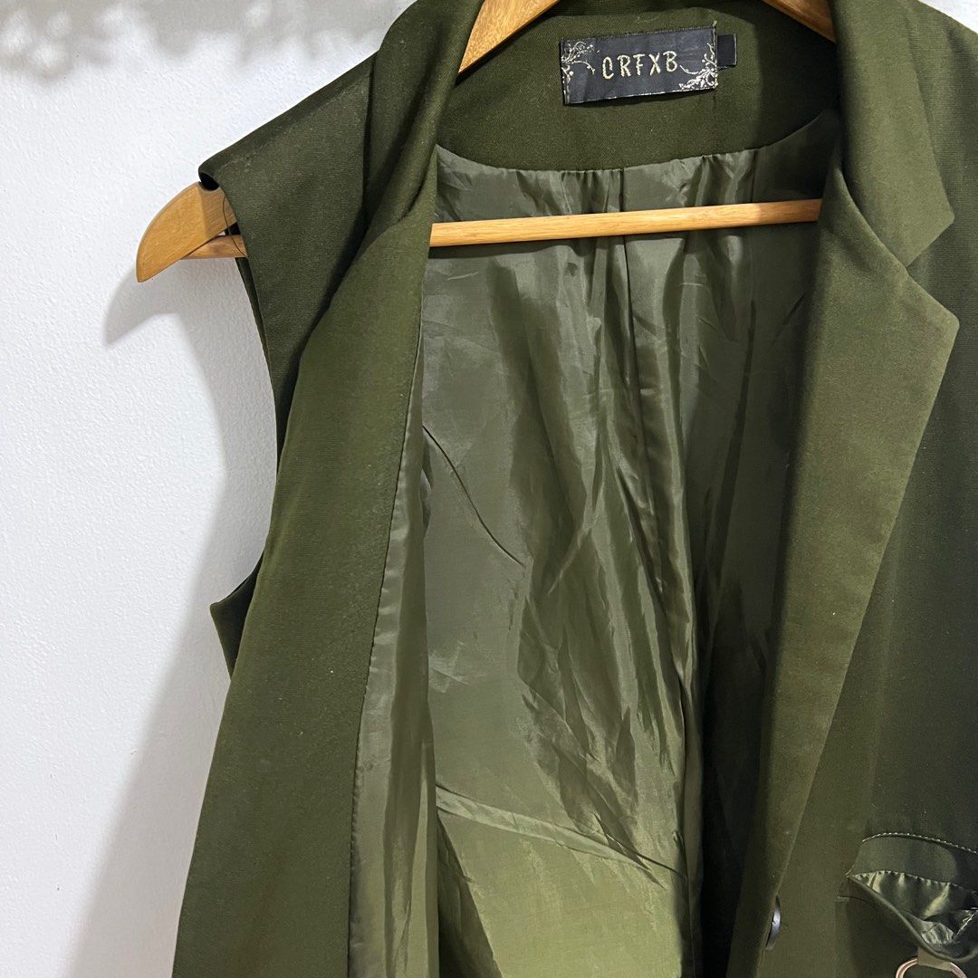 Olive Green Sleeveless Long Vest (Category: Coats, Jackets and Outerwear) located in Las Pinas. Submitted by obsessorizeph (Listing ID 1411049911, Image 3). Description: Sleeveless Long Vest Color — Olive Green Size — Small to Medium | Bust 34” | Shoulder 14” | Length 35” | front button closure Location — Las Piñas City, Metro Manila Mode of Payment — GCash, BDO or BPI ₱400.