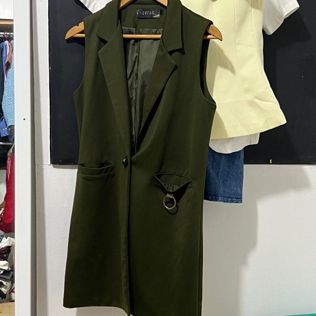 Olive Green Sleeveless Long Vest (Category: Coats, Jackets and Outerwear) located in Las Pinas. Submitted by obsessorizeph (Listing ID 1411049911, Image 2). Description: Sleeveless Long Vest Color — Olive Green Size — Small to Medium | Bust 34” | Shoulder 14” | Length 35” | front button closure Location — Las Piñas City, Metro Manila Mode of Payment — GCash, BDO or BPI ₱400.