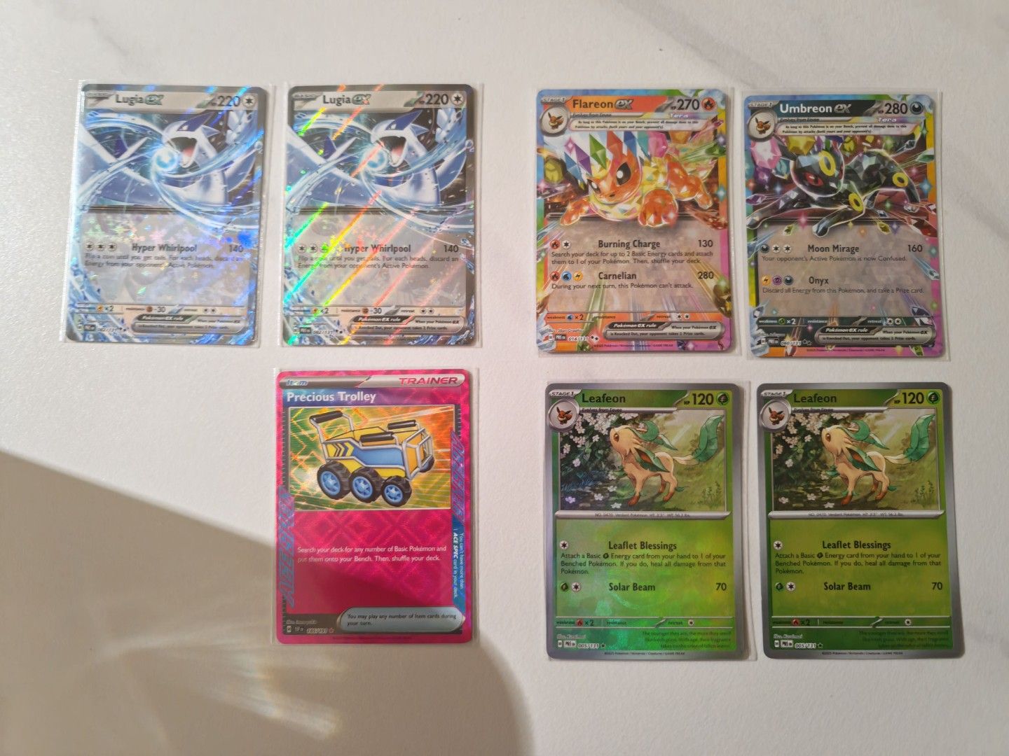 Prismatic Evolution (Category: Vintage Collectibles) located in Singapore. Submitted by endurewe (Listing ID 1411060283, Image 1). Description: Exs and PokeBall all mint condition umbreon - $5 flareon - $4 leafeon - $3 x 2 Lugia - $2 x 2 trolley -$5 take all for $18 $3 for tracked mail.
