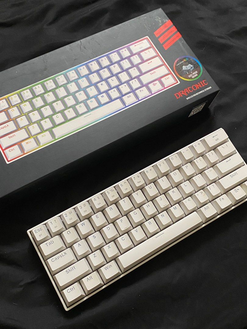 Redragon Draconic 60% Wireless Mechanical Keyboard (Category: Computer Keyboard) located in Malabon City. Submitted by declutteredbycole (Listing ID 1410935713, Image 2). Description: 100% working includes box & inclusions brown switches issue: - no keyboard legs (last pic) - needs cleaning .