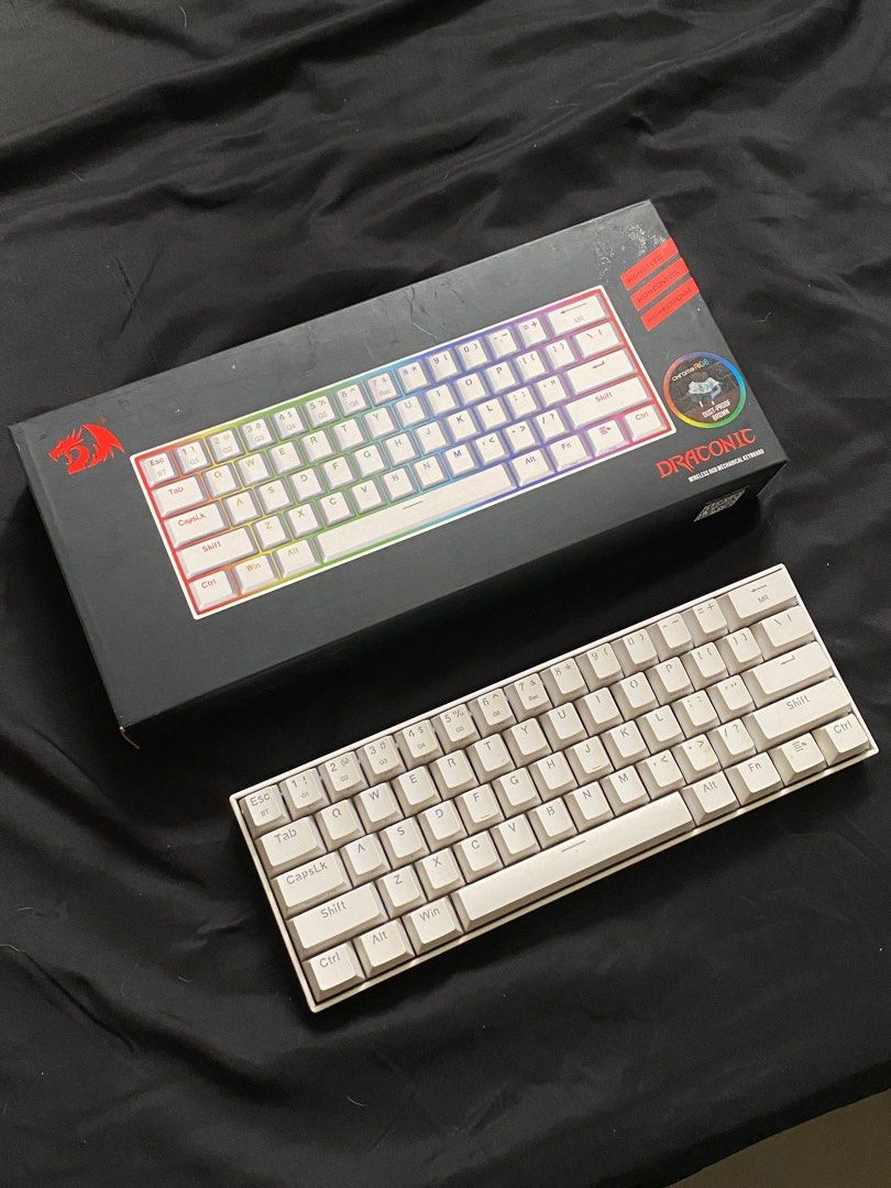 Redragon Draconic 60% Wireless Mechanical Keyboard (Category: Computer Keyboard) located in Malabon City. Submitted by declutteredbycole (Listing ID 1410935713, Image 1). Description: 100% working includes box & inclusions brown switches issue: - no keyboard legs (last pic) - needs cleaning .