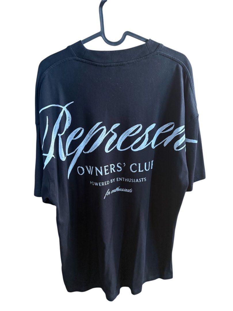 Represent Tee (Category: Tshirts & Polo Shirts) located in Singapore. Submitted by dani_81 (Listing ID 1411033034, Image 2). Description: Worn once only as wrong size. Tshirt in like new condition. Purchased directly from Represent Selfridges. OF selling 168. Website is OOS. Represent Owners Club Script T-Shirt Introducing the latest evolution of the Represent Owners’ Club T-Shirt in Black, an oversized t-shirt crafted from luxury medium weight c