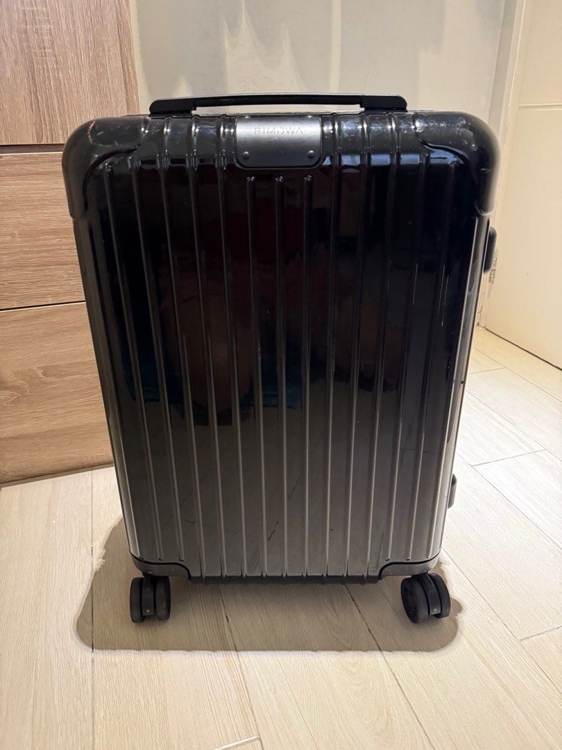 Rimowa Essential Cabin Suitcase Black (Category: Luggage) located in Makati City. Submitted by marckyboy (Listing ID 1410919951, Image 1). Description: - Original Black Rimowa Essential Cabin suitcase - Telescopic handle for easy maneuvering - TSA combination lock for security - Smooth multiwheel system - Interior with two Flex dividers and zipped compartments - Includes Rimowa dust bag - Minor scratches on the exterior - Negotiable upon viewing 