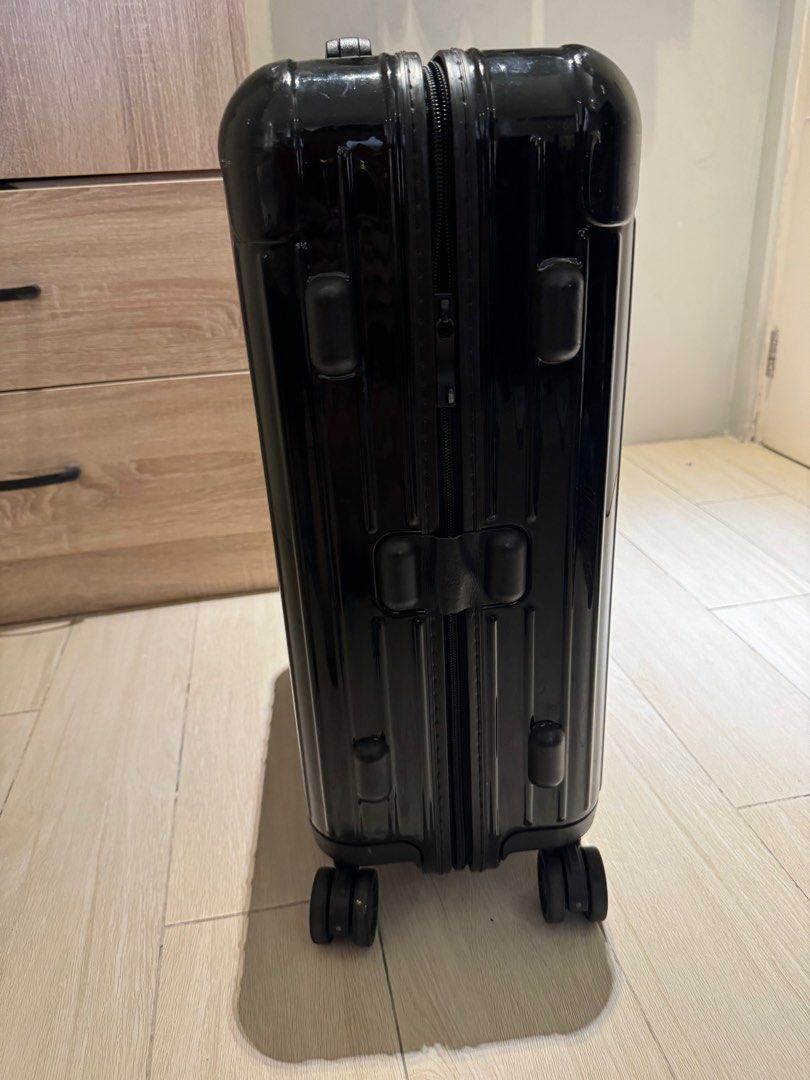 Rimowa Essential Cabin Suitcase Black (Category: Luggage) located in Makati City. Submitted by marckyboy (Listing ID 1410919951, Image 3). Description: - Original Black Rimowa Essential Cabin suitcase - Telescopic handle for easy maneuvering - TSA combination lock for security - Smooth multiwheel system - Interior with two Flex dividers and zipped compartments - Includes Rimowa dust bag - Minor scratches on the exterior - Negotiable upon viewing 