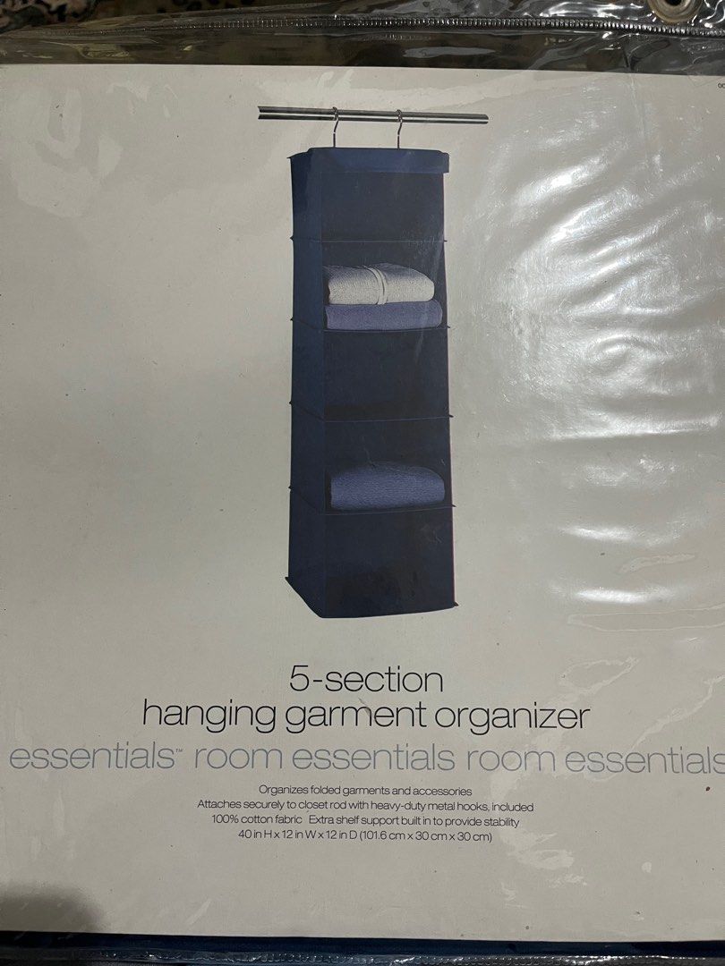 Room Essentials 5-Section Hanging Garment Organizer (Category: Home Improvement Tools & Accessories) located in Antipolo. Submitted by gettinghooked (Listing ID 1410942686, Image 1). Description: Organize your folded garments and accessories with this 5-section hanging garment organizer. It attaches securely to a closet rod with heavy-duty metal hooks. Made of 100% cotton fabric with an extra shelf support built in for added stability. Dimensions
