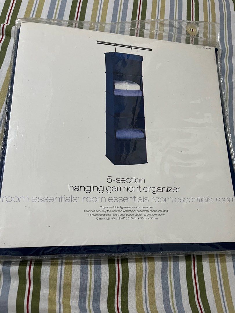 Room Essentials 5-Section Hanging Garment Organizer (Category: Home Improvement Tools & Accessories) located in Antipolo. Submitted by gettinghooked (Listing ID 1410942686, Image 3). Description: Organize your folded garments and accessories with this 5-section hanging garment organizer. It attaches securely to a closet rod with heavy-duty metal hooks. Made of 100% cotton fabric with an extra shelf support built in for added stability. Dimensions