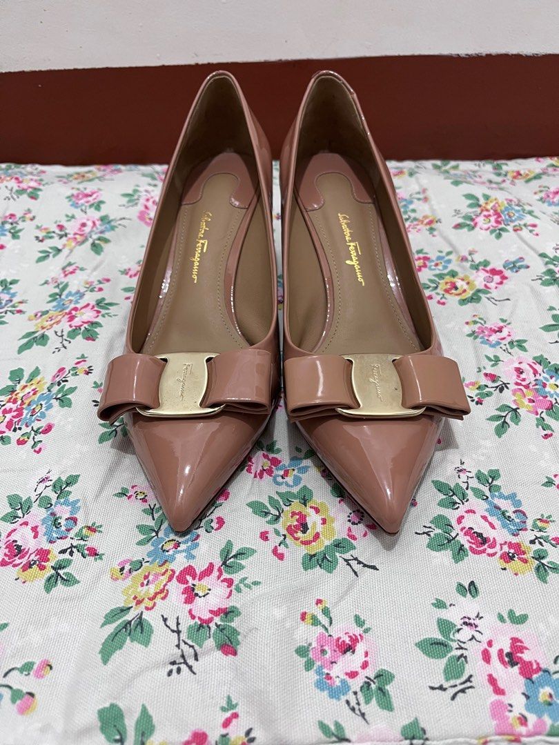 Salvatore Ferragamo Vara Bow Pumps (Category: Heels) located in San Jose. Submitted by mlvd31 (Listing ID 1411011388, Image 2). Description: - Salvatore Ferragamo pumps - Soft pink color - Vara bow with gold-tone buckle - Pointed toe - Mid-height block heel - Made in Italy - Size 8 B.