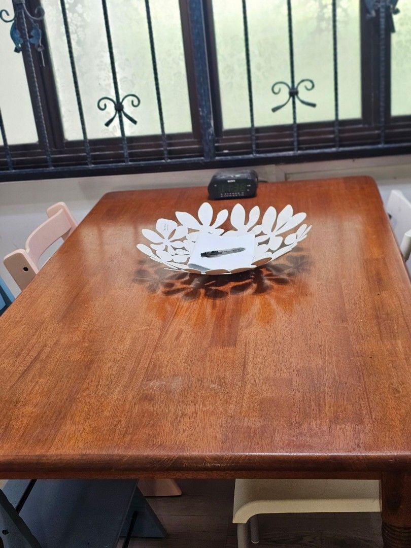 Solid Wood Dining Table (Category: Tables & Sets) located in Singapore. Submitted by mskma (Listing ID 1410925622, Image 3). Description: Classic solid wood dining table with turned legs. chairs in photo included. For 4–6 pax. Smooth surface, stable legs, minor cosmetic marks from use. Condition: Well-used but sturdy. Dimensions approx: 150cm x 80cm x 75cm Self-pickup only. Buyer arrange on mover. .