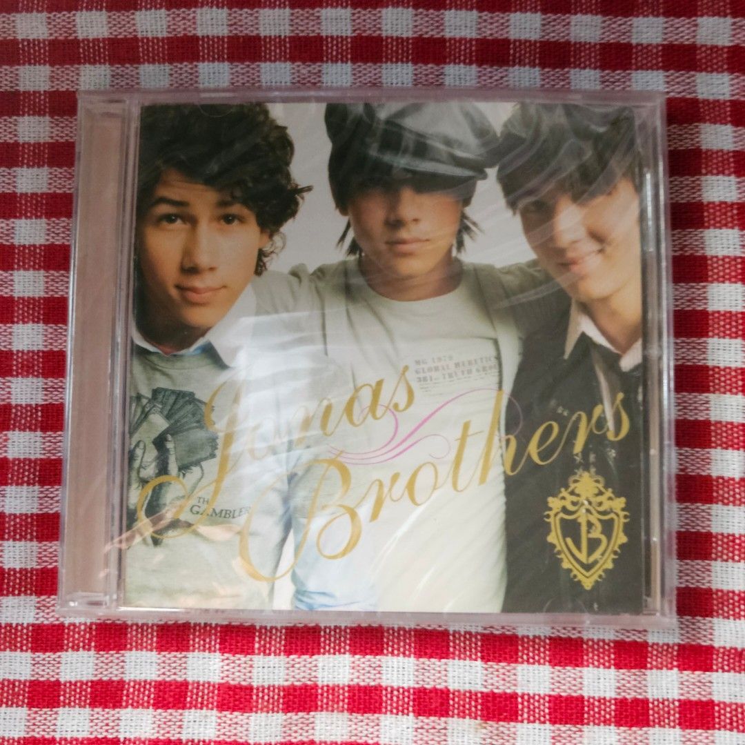 The Jonas Brothers CD - sealed and new (Category: CDs & DVDs) located in Quezon City. Submitted by serefrenpaz (Listing ID 1410922441, Image 1). Description: - Sealed Jonas Brothers CD - Features the band on the cover - Tracklist includes "Year 3000" and "SOS" - CD is in its original, unopened packaging.