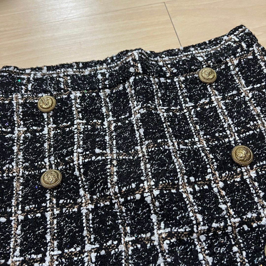 Tweed Skirt with Gold Buttons (Category: Skirts) located in Las Pinas. Submitted by obsessorizeph (Listing ID 1411045806, Image 2). Description: Tweed Skirt with Gold Buttons Material - Tweed | Back zipper Color - Black and white Size - Small| Waist 26-27”| Length 15” Location - Las Piñas City, Metro Manila Mode of Payment - GCash, BDO or BPI ₱250.