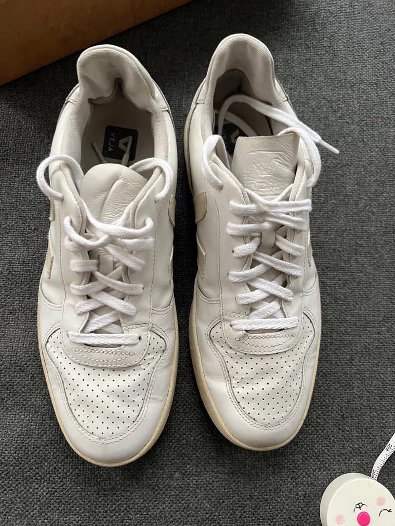 Veja V-10 White Leather Sneakers (Category: Sneakers) located in Quezon City. Submitted by authenticcloset (Listing ID 1410973990, Image 2). Description: - Veja V-10 sneakers - White leather - US 10 / EUR 43 - Iconic V logo - Some sole wear - Includes original box - Made in Brazil Please refer photo for the condition and manage your expectations as this is a used item.