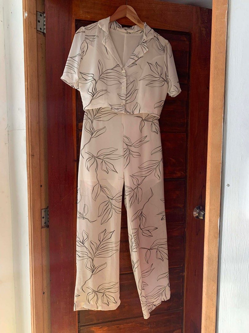 White Floral Co-ord Set (Category: Sets or Coordinates) located in Cavite. Submitted by cssndrakateg (Listing ID 1410979171, Image 1). Description: - Co-ord set includes a white top and wide-leg pants. - Features a stylish black floral print. - Top: Collared neckline and button-down closure. - Pants: Relaxed, comfortable fit. - Ideal for casual outings and summer events..