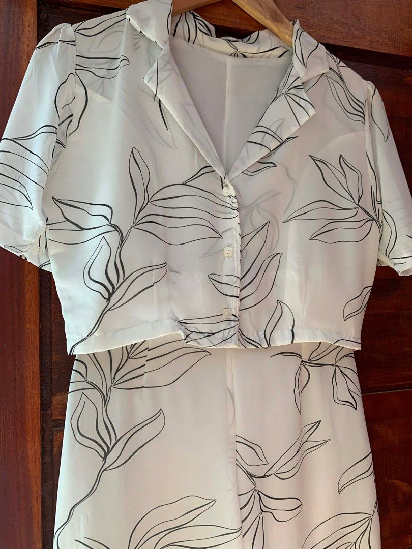 White Floral Co-ord Set (Category: Sets or Coordinates) located in Cavite. Submitted by cssndrakateg (Listing ID 1410979171, Image 2). Description: - Co-ord set includes a white top and wide-leg pants. - Features a stylish black floral print. - Top: Collared neckline and button-down closure. - Pants: Relaxed, comfortable fit. - Ideal for casual outings and summer events..