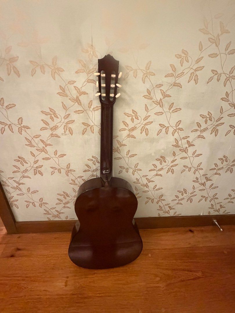 Yamaha C40 - Classical Guitar + gator guitar bag (Category: Musical Instruments) located in Quezon City. Submitted by alyssaaa0 (Listing ID 1411043294, Image 2). Description: - Natural wood finish - Nylon strings - Dark fretboard - Decorative rosette - Dark brown back - Tuning pegs.