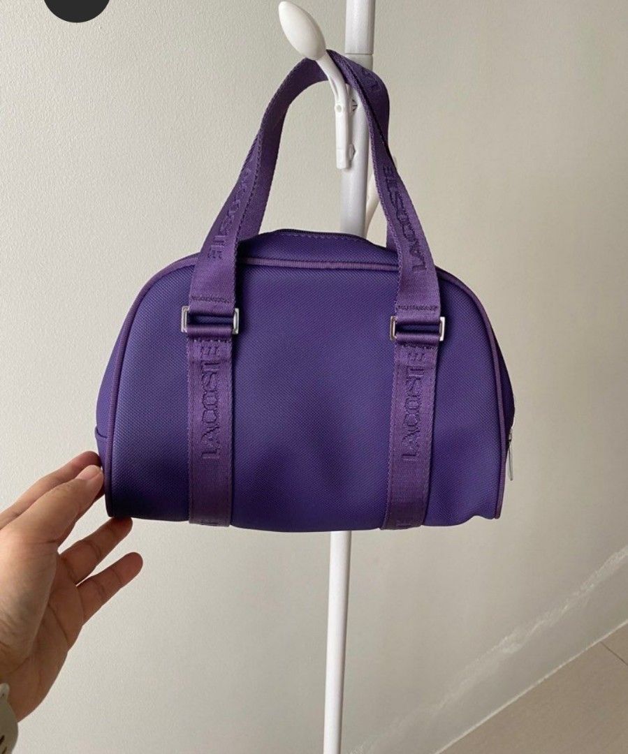 💯 % LACOSTE Classic Women Handbag (Category: Luxury Bags & Wallets) located in Davao. Submitted by iamjllanto (Listing ID 1411196653, Image 1). Description: 💯% LACOSTE Classic Small Handbag in excellent condition. RFS: Extra bag/Impulsive buying Color: Purple For sure buyer, just kindly pm me. Thanks :).