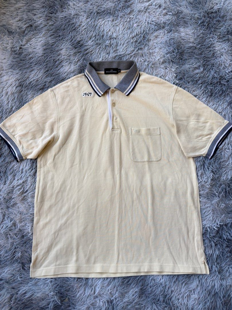 Balenciaga Polo Shirt (Category: Tshirts & Polo Shirts ) located in Legazpi City. Submitted by tiny0509 (Listing ID 1411167878, Image 1). Description: - Balenciaga cream-colored polo shirt - Features a chest pocket - Zipper closure - Contrasting collar and sleeve cuffs - Includes size tag - 24x29.