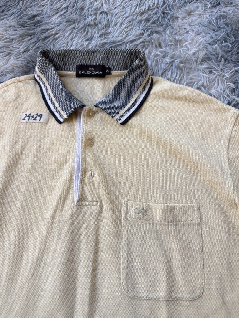 Balenciaga Polo Shirt (Category: Tshirts & Polo Shirts ) located in Legazpi City. Submitted by tiny0509 (Listing ID 1411167878, Image 2). Description: - Balenciaga cream-colored polo shirt - Features a chest pocket - Zipper closure - Contrasting collar and sleeve cuffs - Includes size tag - 24x29.