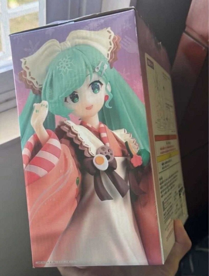 Bandai Namco Snow Miku 2024 Figure RARE (Category: Figurines & Statues) located in Pasig City. Submitted by hazelscollectibles (Listing ID 1411119881, Image 2). Description: - Snow Miku 2024 figure - From Bandai Namco - Brand new, in original packaging - Features a winter-themed outfit - Long turquoise hair - Red and white kimono - Box includes the Bandai Namco logo.