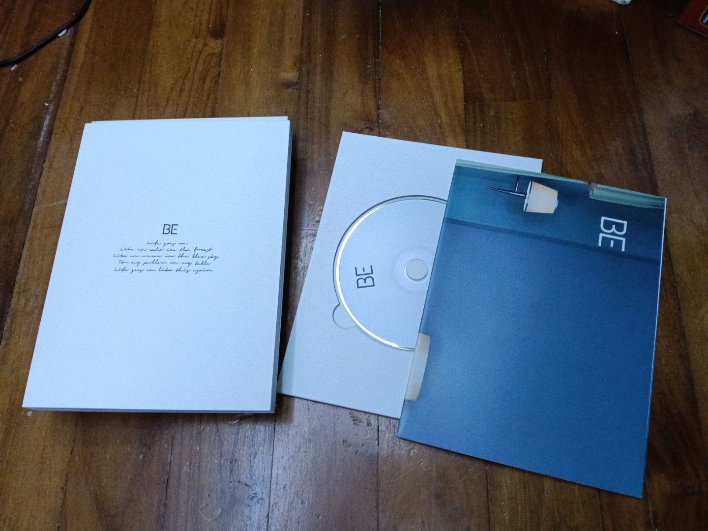 BTS BE album (Category: Musical Instruments) located in Singapore. Submitted by itsjunenotjuly (Listing ID 1411245708, Image 3). Description: BTS Be album would sell both together if anyone wants for 30 have everything that originally inside, including the photo cards , CD , poster and etc.