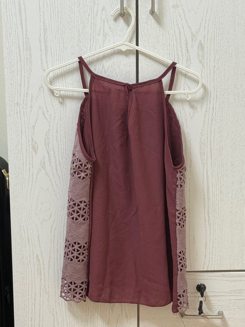 Burgundy Cutout Tank Top (Category: Sleeveless) located in Quezon City. Submitted by _cmls (Listing ID 1411219164, Image 2). Description: - Burgundy tank top - Unique cutout design (front & sides) - Halter neckline - Spaghetti straps - Smooth fabric back - Dress up or down.
