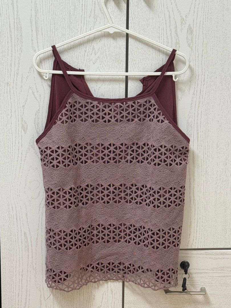 Burgundy Cutout Tank Top (Category: Sleeveless) located in Quezon City. Submitted by _cmls (Listing ID 1411219164, Image 1). Description: - Burgundy tank top - Unique cutout design (front & sides) - Halter neckline - Spaghetti straps - Smooth fabric back - Dress up or down.