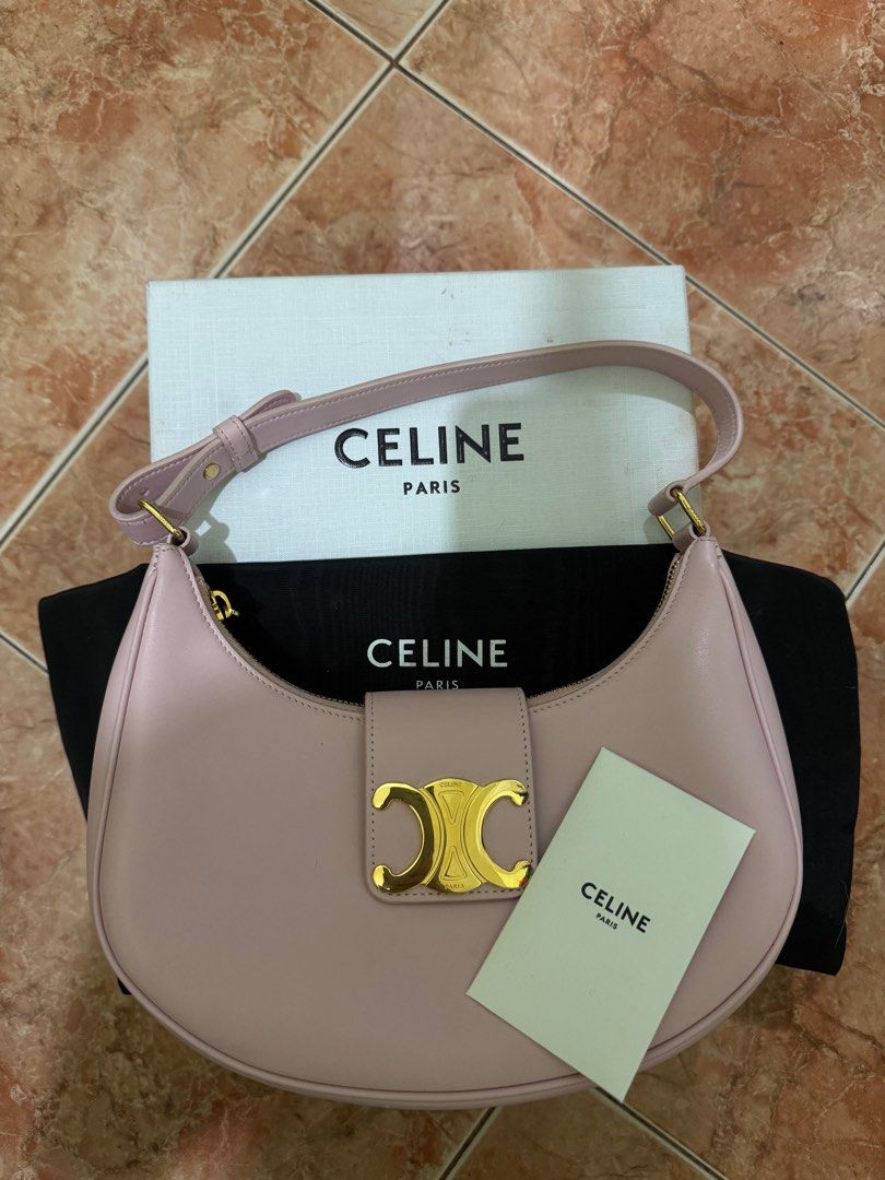 Celine Ava Bag (Category: Luxury Bags & Wallets) located in Bulacan. Submitted by pinkfitchiq (Listing ID 1411140302, Image 1). Description: - Authentic Celine Ava bag - Soft pink color - Gold-tone clasp with Celine logo - Includes original box, dust bag, and authenticity card - Curved shape with single shoulder strap - Celine logo visible on box -like new condition -130orig price.