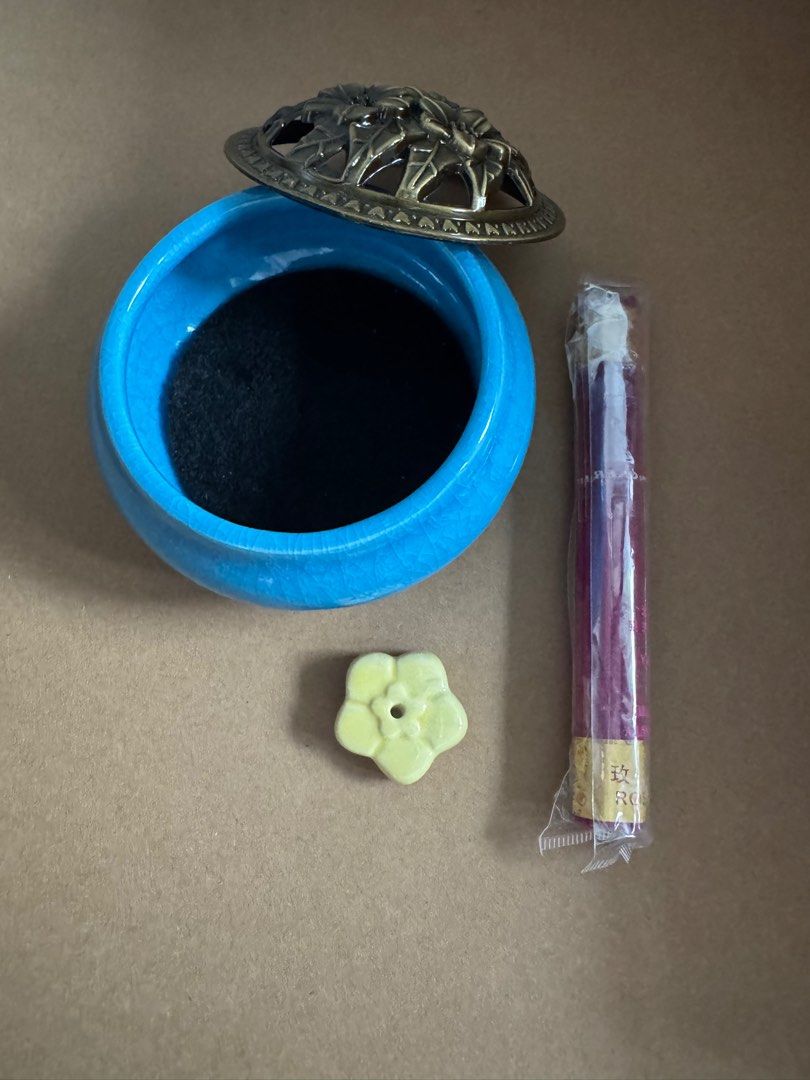 Ceramic Incense Burner with Incense Sticks (Category: Home Fragrance) located in San Juan City. Submitted by kacyyuson (Listing ID 1411231258, Image 2). Description: - Blue ceramic incense burner with crackled glaze - Decorative floral metal lid - Small flower-shaped incense holder - Sealed pack of incense sticks.