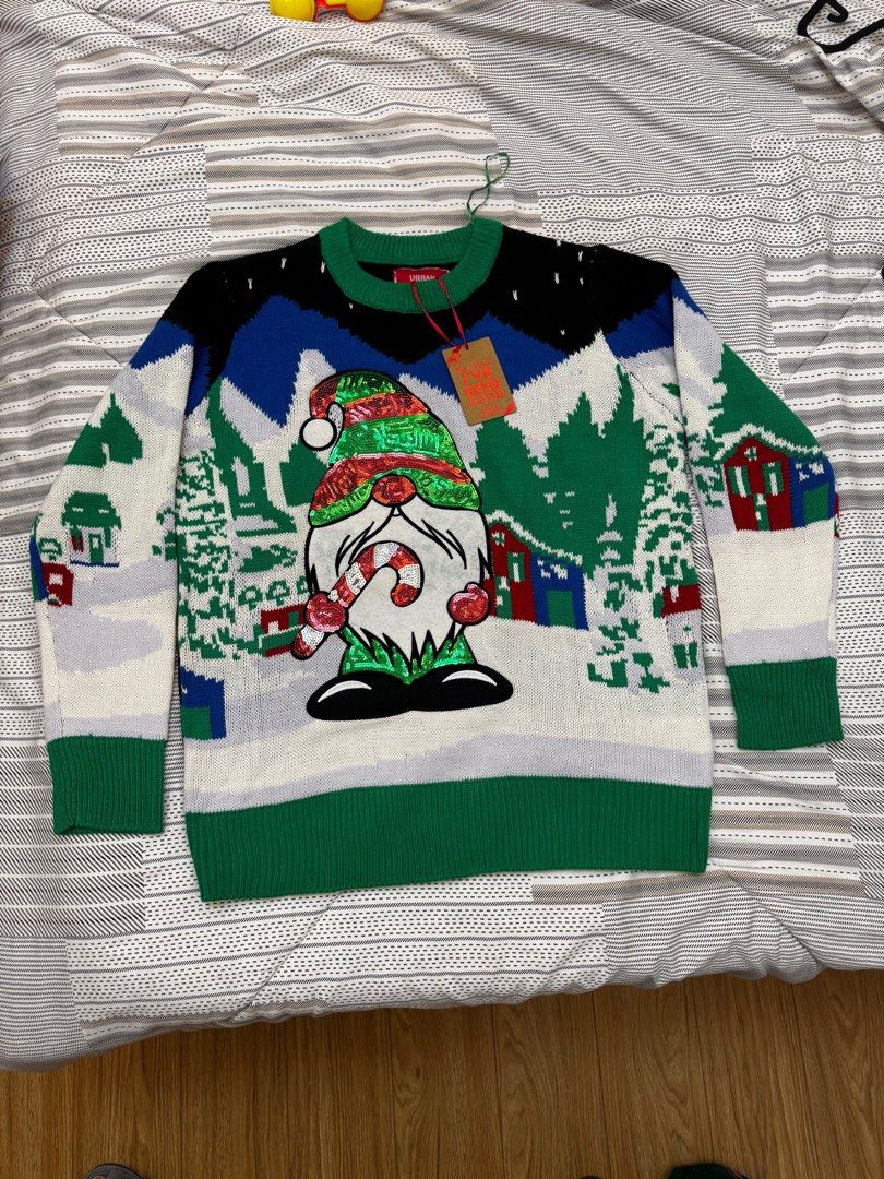 Christmas Sweater / Christmas Ugly Sweaters (Category: Coats, Jackets and Outerwear) located in Manila. Submitted by everythinginbetweenbyk (Listing ID 1411124175, Image 1). Description: - Festive Christmas sweater - Features a gnome design with a candy cane - Color scheme: Green, white, blue, and black - Includes a tag - Green sleeves and bottom hem - From Canada 🇨🇦 .
