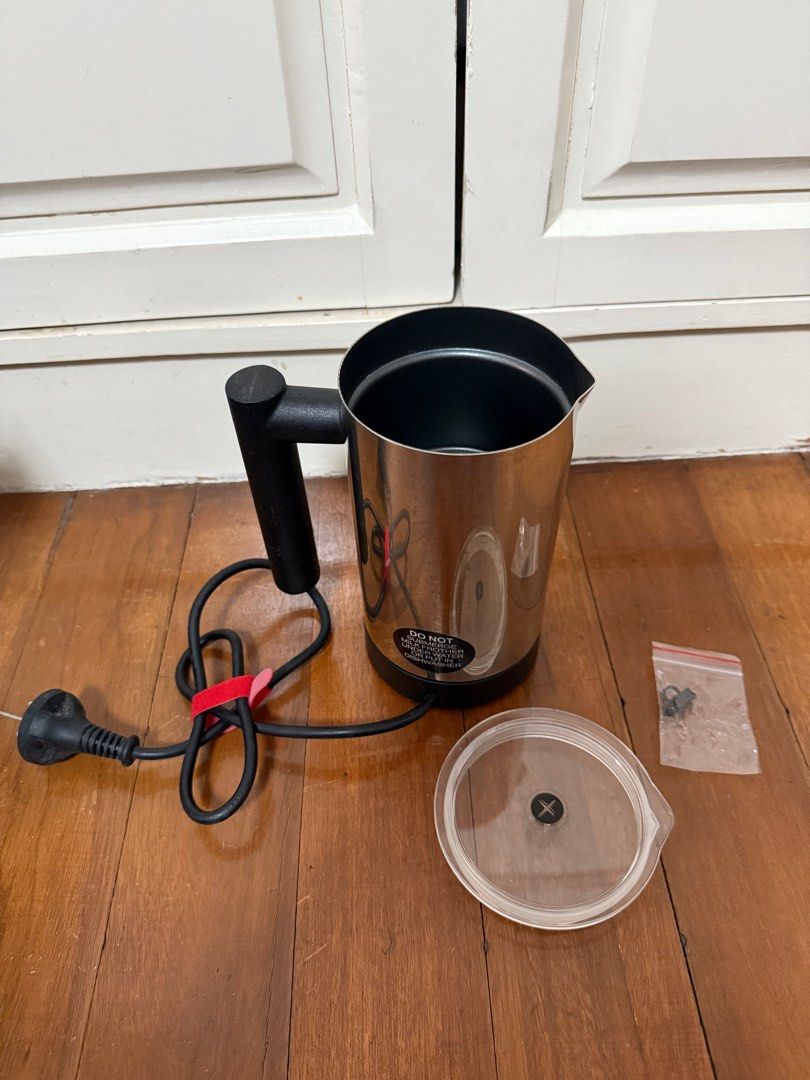 Expressi Milk Frother (Category: Coffee Machines & Makers) located in Manila. Submitted by maag16 (Listing ID 1411124653, Image 2). Description: - Expressi milk frother. Includes the frother itself, lid, and extra parts. - Features a black handle and a power button. - The frother has a stainless steel exterior. - The power cord is included. - The original box is also included. - Warning: Milk brother wire not included. .