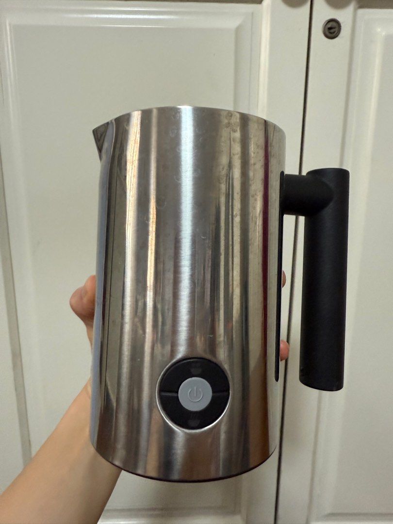 Expressi Milk Frother (Category: Coffee Machines & Makers) located in Manila. Submitted by maag16 (Listing ID 1411124653, Image 3). Description: - Expressi milk frother. Includes the frother itself, lid, and extra parts. - Features a black handle and a power button. - The frother has a stainless steel exterior. - The power cord is included. - The original box is also included. - Warning: Milk brother wire not included. .