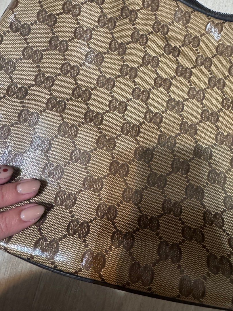 Gucci GG Canvas Hobo Bag (Category: Luxury Bags & Wallets) located in Taguig. Submitted by whitechocolatechip (Listing ID 1411232019, Image 2). Description: - Authentic Gucci hobo bag -Snake leather type - Iconic GG canvas - Brown leather strap and trim - Gold-tone buckle and charm - Brown fabric interior with pocket - NO FLAWS - Includes serial number.