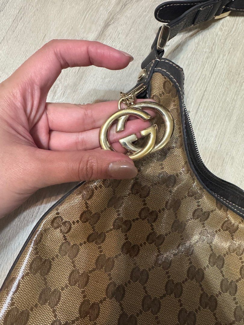 Gucci GG Canvas Hobo Bag (Category: Luxury Bags & Wallets) located in Taguig. Submitted by whitechocolatechip (Listing ID 1411232019, Image 3). Description: - Authentic Gucci hobo bag -Snake leather type - Iconic GG canvas - Brown leather strap and trim - Gold-tone buckle and charm - Brown fabric interior with pocket - NO FLAWS - Includes serial number.