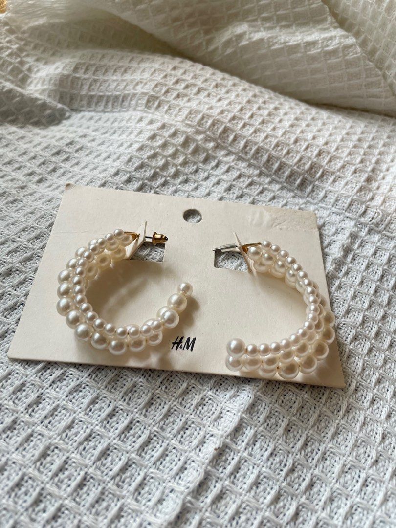H&M Pearl Hoop Earrings (Category: Earrings) located in Pasig City. Submitted by AlbertCruz97 (Listing ID 1411134528, Image 3). Description: - H&M hoop earrings - Layered design - Features faux pearls - Post back closure - Lightweight and comfortable.