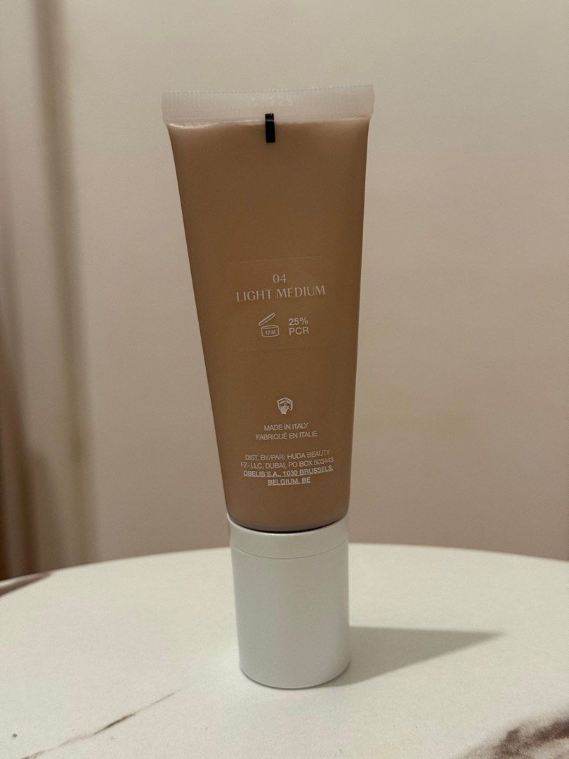 Huda Beauty GloWish Multidew Vegan Foundation in 04 Light Medium 40mL (Category: Makeup) located in Quezon City. Submitted by quirksandcurls (Listing ID 1411174207, Image 2). Description: .