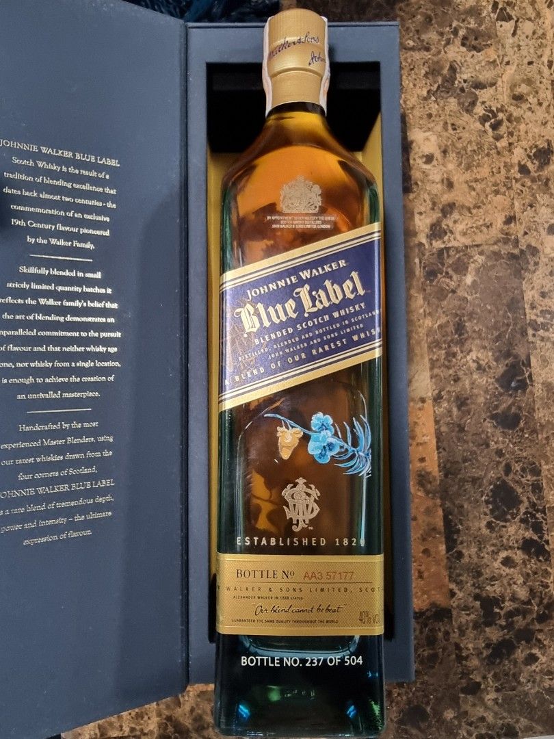 Johnnie Walker Blue Label Limited Edition Davao (Category: Beverages) located in Caloocan City. Submitted by brydgreat (Listing ID 1411211121, Image 2). Description: Johnnie Walker Blue Label Scotch Whisky. This limited edition bottle features a unique design. Bottle number is 237 of 504. Comes with the original box. The bottle has a detailed illustration. The box is blue with gold accents and has some minor wear on the corner..
