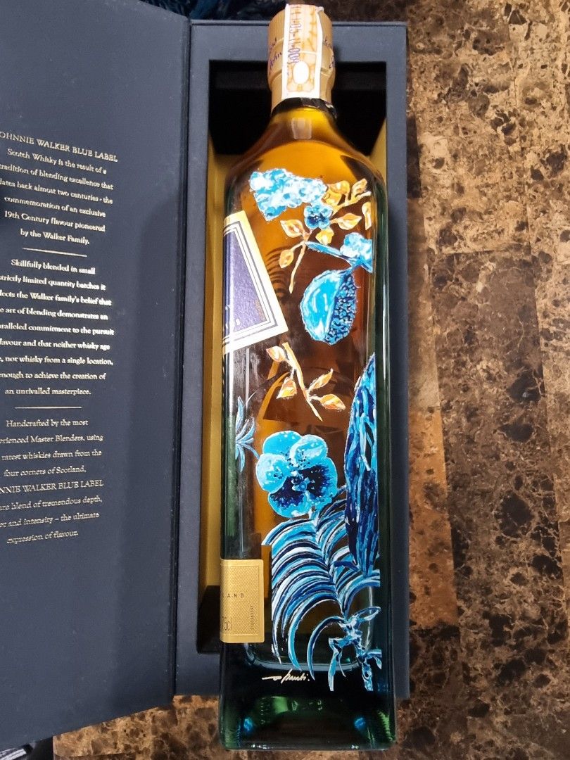 Johnnie Walker Blue Label Limited Edition Davao (Category: Beverages) located in Caloocan City. Submitted by brydgreat (Listing ID 1411211121, Image 3). Description: Johnnie Walker Blue Label Scotch Whisky. This limited edition bottle features a unique design. Bottle number is 237 of 504. Comes with the original box. The bottle has a detailed illustration. The box is blue with gold accents and has some minor wear on the corner..